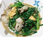 牡蠣と有機春菊の中華炒め写真